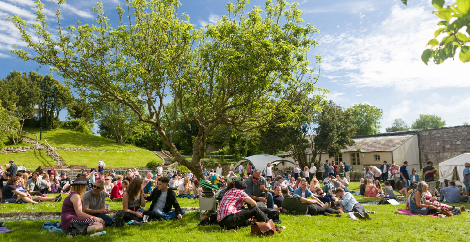 People relaxing on the grass in the sun